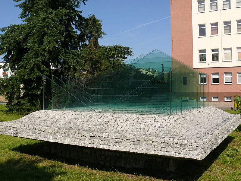 The K-dron monument in Koło, Poland, a glass K-dron on a stone base